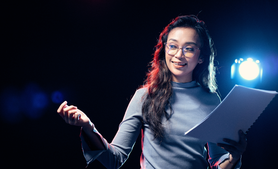 A lady telling the brand story to the audience